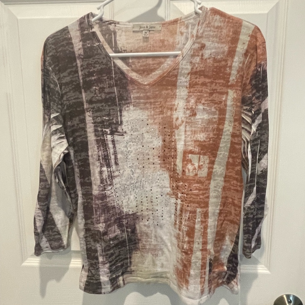 Made in USA. 3/4 sleeves. Lightweight shirts with some sparkles on front. Size M